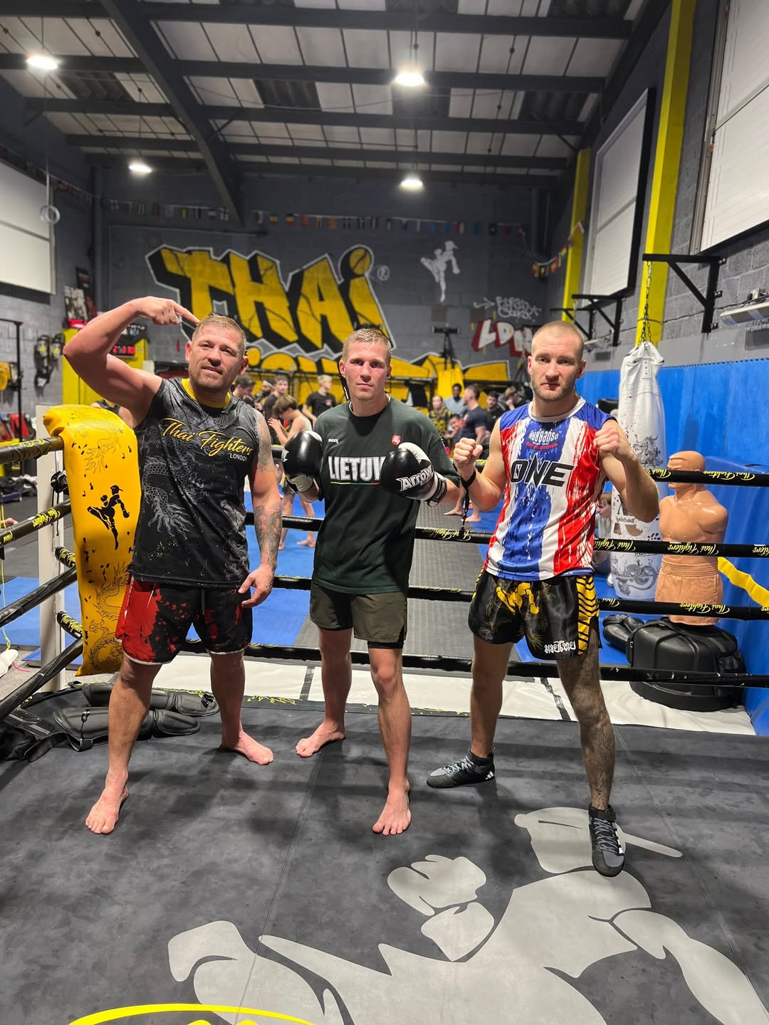 Darius with training partners in Thai Fighters ring